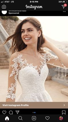 a woman in a wedding dress posing for the camera