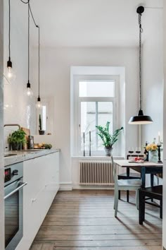 the kitchen is clean and ready to be used for dinner or lunchtime, with no one in it