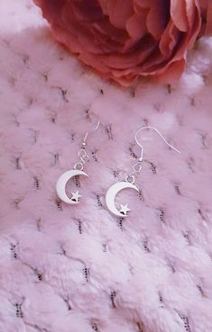 Grab yourself a pair of these pretty little crescent moon/star earrings... sailor moon inspired  The moon charms are approx 10mm x 10mm and are hanging on silver plated lead and nickel free earring hooks 🖤 Gorgeous simplistic earrings, very strong but dainty looking  Would make a great gift  I can make clip on version of these for none pierced ears just add a message in note to seller 😊 Silver Crescent Earrings With Star Charm, Crescent Earrings With Star Charm For Gift, Crescent Earrings With Star Charm As Gift, Crescent Shaped Earrings With Star Charm For Gift, Crescent-shaped Earrings With Star Charm As Gift, Dainty Silver Earrings With Moon Charm, Cute Silver Jewelry With Star Charm, Simplistic Earrings, Pretty Moon