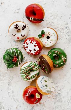 there are many different donuts on the table and one is decorated with icing