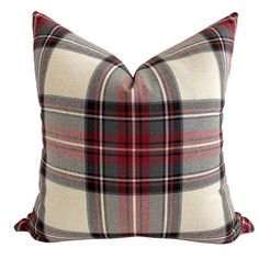 a plaid pillow on a white background