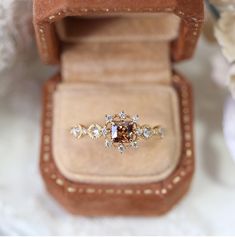 an engagement ring in a velvet box