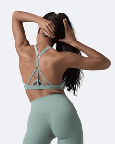 The perfect blend of fashion and functionality that will catch everyone’s eye. This top goes with everything, but match it with our body-shaping leggings and it's game over! High Stretch Tops With Built-in Padding For Pilates, Fitted Yoga Top With Built-in Padding, Fitted Athleisure Tops With Built-in Padding, Compression Tops With Built-in Padding For Pilates, Yoga Compression Top With Bra Friendly Design, Compression Yoga Top Bra Friendly, Versatile Sculpting Activewear For Workout, Compression Tops With Built-in Padding For Training, High Stretch Tops With Built-in Padding For Gym