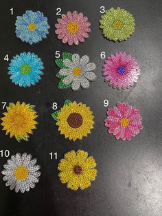 several different types of flowers are shown on a black surface with numbers in the middle