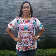 This feminine vintage style shirt is beautifully made. Black with colorful flowers, it is a unique one of a kind. It is shown with a belt as an example of how you might want to wear it. Since it is hand embroidered, each flower is slightly different. It is made of cotton and it extremely comfortable. About Our Items: Each one of our items are handmade/hand woven by Indigenous communities of Chiapas and Oaxaca in Mexico. Great care has been taken to ensure the quality of uniqueness of each item w Traditional White Shirt For Festivals, Fitted Multicolor Bohemian Shirt, Traditional Multicolor Printed Shirt, Traditional Short Sleeve Printed Blouse, Traditional Printed Shirt For Festivals, Multicolor Bohemian Crew Neck Blouse, Multicolor Bohemian Blouse With Crew Neck, Multicolor Bohemian Shirt For Festivals, Multicolor Floral Print Blouse For Festivals