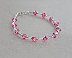 "Sparkly pink crystal bracelet is made with rose and clear Austrian crystals and tiny silver beads. Sterling silver lobster clasp. ❖ 6mm Austrian crystals ❖ sterling silver ❖ silver fill Bracelet shown is 7.5\" in length." Adjustable Pink Faceted Crystal Bracelet, Pink Hypoallergenic Sterling Silver Bracelets, Hypoallergenic Pink Sterling Silver Bracelets, Pink Hypoallergenic Sterling Silver Bracelet, Nickel-free Pink Crystal Bracelet As A Gift, Pink Sterling Silver Crystal Bracelet As A Gift, Adjustable Nickel-free Pink Crystal Bracelet, Pink Sterling Silver Bracelet With Lobster Clasp, Elegant Pink Crystal Sterling Silver Bracelet