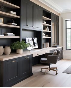 a home office with built in bookcases and desk