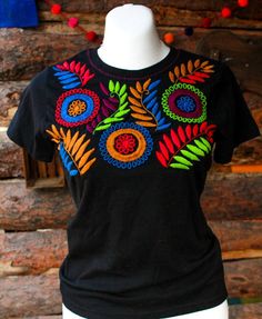 "Mexican embroidered shirt Beautiful embroidered blouse. This is handmade in Mexico. Perfect for those summer days at the beach, or for your fiesta parties. The embroidery colors may vary due all the handmade work (not the design). If you want an specific color, please send us a message so we can send you the ones available so you can choose. Size: Extra Small: 13\" width x 22\" long Small; 14\" width x 23\" long Medium: 15 1/2\" width x 24\" long (Width: shoulder - shoulder) Please also notice Summer Festival Embroidered Shirt, Multicolor Floral Embroidered T-shirt For Summer, Beach Cotton Embroidered Shirt, Bohemian Embroidered Summer T-shirt, Multicolor Floral Embroidery T-shirt For Summer, Bohemian Floral Embroidery T-shirt For Summer, Multicolor Embroidered Short Sleeve Shirt, Bohemian Multicolor Embroidered Shirt For Summer, Bohemian Floral Embroidery Summer T-shirt