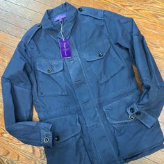 Size Medium Purple Label Designer Cotton Outerwear With Pockets, Spring Blue Outerwear With Flap Pockets, Blue Utility Outerwear With Flap Pockets, Navy Outerwear With Patch Pockets For Spring, Designer Navy Outerwear With Pockets, Spring Blue Utility Jacket With Flap Pockets, Blue Utility Jacket With Patch Pockets For Fall, Designer Navy Long Sleeve Outerwear, Designer Blue Outerwear For Spring