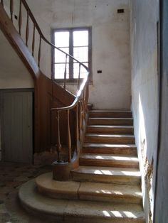 the stairs are made of stone and wood