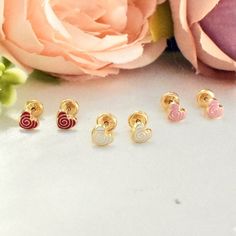 "These adorable 14K solid yellow gold heart stud earrings are the perfect gift for your precious baby girl. The earrings are small and lightweight, with screw backs to ensure a secure fit. The hearts are enameled in a variety of colors to choose from, so you can find the perfect pair to match your baby's style. ♡ 14K Solid Gold  ♡ Suitable for daily wear ♡ Light weight ♡ Hypoallergenic ♡ Nickel free ♡ Waterproof ♡ Tarnish Resistant About BrazilAJ: * \"Welcome to BrazilAJ, a family-owned business 14k Gold White Heart Earrings For Gift, White 14k Gold Heart Earrings Gift, Cute Gold Heart Earrings For Mother's Day, Gold Heart Stud Earrings, Gold Heart Earrings, Gold Heart Studs, Gold Heart Earring, Celtic Pendant, Heart Stud Earrings