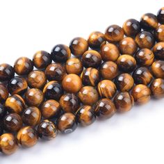 tiger's eye beads are stacked on top of each other