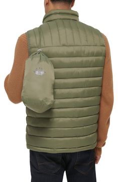 A quilted stand collar and lightweight fill insulate this heat-keeping puffer vest. 26 1/2" length (size Medium) Stand collar Front zip closure Front zip pockets Water resistant 100% nylon Machine wash, tumble dry Imported Travel Down Puffer Jacket, Solid Color Quilted Puffer Jacket, Travel Nylon Puffer Jacket, Solid Color Puffer Jacket With Zipper For Outdoor, Casual Windproof Nylon Puffer Jacket, Solid Puffer Jacket With Zipper Closure For Outdoor, Solid Puffer Jacket With Zipper For Outdoor Activities, Casual Nylon Windproof Puffer Jacket, Casual Packable Puffer Jacket For Outdoor Activities