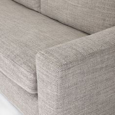 a close up view of the back end of a couch with no cushions on it