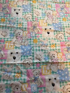 teddy bears and stars on a multicolored checkered fabric with the letter d