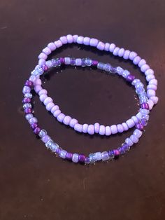 These handmade purple bracelets are just full of bright color!  Either one is sure to please any purple lover like myself!  Whether you decide on the light purple, shades of purple, or stack them both, I'm sure they will look gorgeous on you!  Very nice, bright colors. They compliment each other well.  Simple, but still adds color to any outfit! Adults and kids sizes available! Bohemian Purple Stretch Bracelet With Round Beads, Purple Round Beads Bracelet For Beach, Adjustable Purple Beaded Bracelets Casual Style, Adjustable Casual Purple Beaded Bracelets, Casual Adjustable Purple Beaded Bracelets, Purple Bracelet Jewelry For The Beach, Purple Bracelet Jewelry For Beach, Handmade Purple Stretch Bracelet For Beach, Handmade Adjustable Purple Bracelets