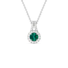 The refined elegance of this gemstone pendant allows you to elevate the look of any outfit in an instant. The pendant features a Round Shape Emerald on its center framed by a classic halo of lab-grown diamonds. A diamond-studded split bale holds the halo-wrapped colored gem. Luxury Round Cut Halo Necklace, Luxury Halo Design Round Pendant Jewelry, Green Diamond Necklace With Halo Setting, Luxury Round Pendant Halo Diamond Necklace, Sapphire Halo Pendant, Halo Pendant, Gorgeous Engagement Ring, Colored Gems, Emerald Gemstone