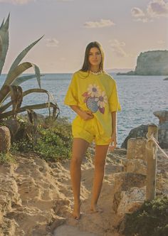 Cozy up in our sunshine-yellow tee, kissed by strawberries for a tutti-frutti twist! Oversized fit Crew neckline Short sleeves Breathable Lightweight, non-stretch fabrication 100% Cotton Made ethically in Bali Please note that slight variations and colour irregularities may occur, as the garment is hand-dyed. Refer to swatch image for an accurate design. Model wears a size small. Measurements based off size medium.Under arm to under arm: 70cmShoulder high point to hem: 70cmGrade Rule: 2.5cm diff Casual Yellow T-shirt For Vacation, Oversized Yellow T-shirt For Spring, Yellow T-shirt With Lemon Print For Spring, Casual Yellow T-shirt For Loungewear, Yellow Summer T-shirt For Loungewear, Yellow T-shirt For Summer Loungewear, Summer Lemon Print Graphic Tee, Summer Short Sleeve T-shirt With Lemon Print, Short Sleeve Lemon Print T-shirt For Summer