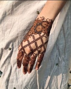 a person with henna on their hand