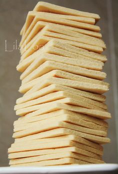 a stack of crackers sitting on top of a white plate