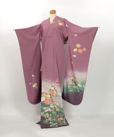 This exquisite vintage Furisode kimono is crafted from 100% silk and adorned with delicate bokashi-dyeing and yuzen-dyed patterns.  The kimono features a harmonious array of symbols including elegant flowers, traditional bridges, kaioke (shell boxes), fans, and the auspicious lucky mallet, or uchide-no-kozuchi.  Each motif is thoughtfully arranged to embody the grace and beauty of Japanese culture, where fans symbolize prosperity and the lucky mallet represents the granting of wishes.  The gentle gradient created by bokashi-dyeing adds depth and sophistication, making this kimono perfect for wear or as a captivating interior display.  In excellent condition with no visible stains, this piece is also ideal for crafting projects, adding a touch of traditional beauty to any setting. Size (Fur Furisode Kimono, Traditional Beauty, Interior Display, Elegant Flowers, The Grace, Japanese Culture, Kimonos, Dress Clothes For Women, Festival Season