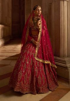 Editor's Note Fuschia Red Raw Silk Bridal Lehenga Choli With A Tulle Dupatta Heavily Embroidered With Antique Zardozi Work With A Touch Of Mirrors. There Is An Optional Lighter Tulle Dupatta With The Set With Additional Charges Color: Fuschia Red Fabric: Raw Silk+ Tulle Care: Dry Clean Only About the Designer Nitika Gujral�’s journey with designing clothes started almost four decades back while she was still in high school and held her first exhibition for family and friends. Making clothes has b Bride Lehenga, Designing Clothes, Reception Outfit, Raw Silk Lehenga, Zardozi Work, Wedding Lehengas, Making Clothes, Bridal Lehenga Red