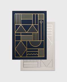 two greeting cards, one in gold and the other in black with an abstract design