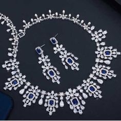 Ornate%20Sapphire%20Blue%20CZ%20Wedding%20Jewelry%20Set%0D%0AComplete%20your%20regal%20wedding%20day%20look%20with%20our%20elegant%20%22something%20blue%22%20Sapphire%20CZ%20necklace%20and%20earring%20set.%20This%20stunning%20platinum%20silver%20plated%20jewelry%20set%20is%20adorned%20with%20brilliant%20AAAAA%20quality%20clear%20and%20sapphire%20blue%20CZ%20crystals%20that%20will%20add%20dazzling%20sparkle%20to%20any%20wedding%20or%20special%20occasion%20ensemble.%26nbsp%3B%0D%0AYou'll%20feel%20like%20royalty%20wearing%20this%20ornately%20designed%20jewelry%20set!%0D%0ASize%3A%20The%20necklace%20is%20about%2016%22%20long%20and%20the%20pierced%20earrings%20are%26nbsp%3B%20about%202.2%22%20long%20and%20.7%22%20wide.%0D%0AColor%3A%20Silver%2FSapphire%20Blue%2FClear.%0D%0AStyle%3A%20ne1011S-S. Formal Jewelry, Wedding Jewelry Set, Cz Necklace, Set Style, Silver Plated Jewelry, Wedding Jewelry Sets, Sapphire Blue, Something Blue, Your Special