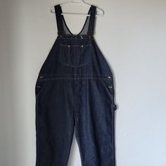 Vintage Montgomery Ward Blue Denim Work Overalls Bib Polyester Cotton Blend Made In Usa Condition Is Pre-Owned In Good Condition. Some Holes On Leg Area, See Pictures. Please Note: Don't Go By Size Number, Do Check Measurements Listed Below To Determine If The Item Will Fit. Actual Measurements: Approximately (Laying Flat). -Waist: 26 Inches -Hip: 28 Inches -Length: 47 Inches The Condition Guide: -New With Tags - Never Been Used Condition. Tags Are Still Attached. -New Without Tags - No Wear To Utility Denim Bib Front Bottoms, Utility Denim Bottoms With Bib Front, Denim Bib Front Jeans For Workwear, Medium Wash Bib Front Jeans For Work, Workwear Bib Front Jeans With Pockets, Workwear Jeans With Bib Front And Pockets, Denim Bib Front Bottoms For Workwear, Workwear Denim Overalls In Medium Wash, Workwear Bib Front Jeans