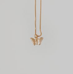 This butterfly necklace will add a delicate touch to any look with its chain and pendant. Treat yourself or a loved one to a unique piece of jewelry today! ∙ D E T A I LS ∙- 18k Gold Filled- 18 inches in length- Box Chain - Hypoallergenic (lead + nickel free) ∙ G O L D ∙ F I L L E D ∙ Gold-filled components contain 100+ times more real gold than gold-plated components and are both durable and tarnish resistant. It is more affordable and accessible than solid gold but higher quality than gold plated. Mother's Day Jewelry Pendant With Butterfly Charm, Mother's Day Jewelry With Butterfly Pendant, Mother's Day Butterfly Pendant Jewelry, Dainty Butterfly Charm Jewelry For Mother's Day, Butterfly Charm Pendant Necklace As Gift, Butterfly Charm Pendant Necklace For Gift, Butterfly Necklace With Adjustable Chain For Gift, Yellow Gold Butterfly Charm Jewelry For Everyday, Dainty Gold-plated Butterfly Jewelry