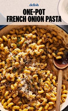 one - pot french onion pasta in a skillet with a wooden spoon on the side