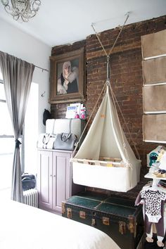 a hanging hammock in the corner of a room