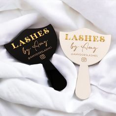 two paddles that say lashes by anny and lashes by andyoleahes