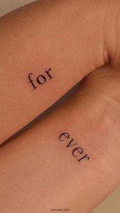 two wrist tattoos with the words for ever written on them