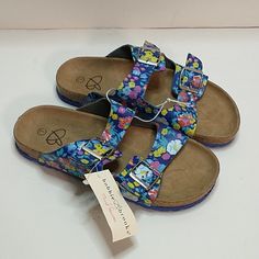 Bobbie Brooks Floral Pattern Sandals. Size Large (2-3). The Sandals Have Blue Straps With Flowers On Them. The Straps Have Buckles And Are Adjustable. Bundle And Save On Shipping, We Have A Large Variety Of Items. 83022 Cute Blue Sandals For Vacation, Playful Blue Adjustable Sandals, Playful Blue Sandals For Summer, Playful Adjustable Blue Sandals, Playful Slip-on Sandals For Spring, Fun Adjustable Sandals For Spring, Trendy Blue Non-slip Sandals, Adjustable Fun Sandals For Spring, Playful Blue Sandals For Spring