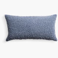 a blue pillow on a white background