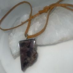 This Is A Handmade Necklace With An Unknown Grey/Purple Colored Stone With A Half Bezel Around It Partly,It Comes On A Adjustable Suede Cord So As To Fit Anyone Who Wants To Wear Itit Comes From A Smoke And Pet Free Environment And Can Be Shipped The Same Day Order Is Placed Unique Adjustable Purple Necklace, Purple Amethyst Jewelry For Festival, Purple Pendant Jewelry For Festival, Purple Amethyst Necklace For Festival, Purple Bohemian Everyday Jewelry, Adjustable Purple Pendant Jewelry, Adjustable Purple Necklace For Gifts, Adjustable Purple Necklace For Gift, Adjustable Lavender Amethyst Necklace