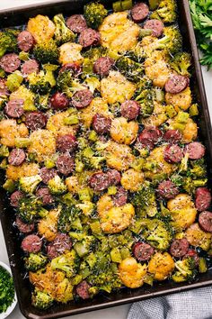 sausage and broccoli casserole in a baking dish with parmesan cheese