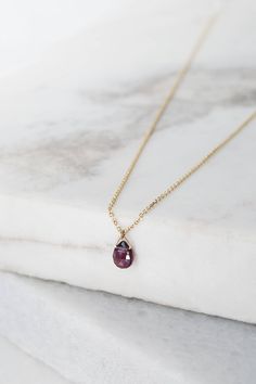 "\"A simple but elegant garnet pendant! January's birthstone has a deep red color. It is believed that those who wear it will have good health, peace, and wealth. It is also a symbol of good friendship. An exquisite and thoughtful gift! Easy to wear all day long or on a special occasion for a chic and sophisticated look! Is it for you? Even better! Everyone deserves a little treat once in a while!\" --Fairy Goldcharm Check out some layering options! https://www.etsy.com/listing/513878526/diamond Dainty Ruby Gemstone Birthstone Necklace, Garnet Birthstone Necklaces In Fine Jewelry Style, Garnet Birthstone Necklace In Fine Jewelry Style, Garnet Birthstone Fine Jewelry Necklace, Classic Garnet Birthstone Necklace, 14k Gold Briolette Gemstone Birthstone Necklace, 14k Gold Briolette Birthstone Necklace With Gemstone, Gold Chain Pendant, Paw Print Bracelet