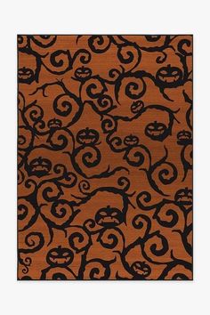 an orange and black pattern with swirls on it