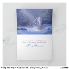 a christmas card with an image of a white horse and its baby in the snow