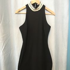 A High, Bead-Embellished Neckline Frames The Face Atop An Elegant Figure-Skimming Dress Cut To Showcase The Shoulders. 40" Length (Size 8). Back Zip Closure. Stretch Lining. 54% Polyester, 38% Viscose Rayon, 8% Elastane. Dry Clean. Chic Sleeveless Dresses With Pearl Embroidery, Chic Party Dress With Embellished Collar, Elegant Embellished Sleeveless Bodycon Dress, Elegant Sleeveless Embellished Bodycon Dress, Chic Stretch Embellished Bodycon Dress, Fitted Party Dress With Embellished Collar, Elegant Stretch Embellished Mini Dress, Fitted Embellished Halter Neck Mini Dress, Elegant Embellished Halter Neck Mini Dress