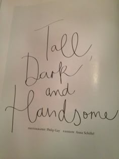 a handwritten sign that says,'tale dark and handsome '