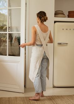 Achieve the ideal fusion of practicality and elegance with our beige stripe pinafore linen apron. Meticulously handcrafted using premium quality European linen, this Japanese-style cross-back apron offers both functionality and sophistication. With spacious front pockets and a hassle-free design, it's tailored to streamline your daily tasks effortlessly. DETAILS - Handmade from premium quality European linen - Certified linen fabric free from harmful chemicals - The apron features front pockets and a cross-back style - Pre-washed for exceptional softness - Extremely durable - Shipped in sustainable packaging - Machine washable CUSTOM SIZES: Unfortunately, currently we do not offer customization for linen aprons. NOTE: Actual color of the product may slightly vary depending on the photograp Linen Aprons, Japanese Style Apron, Linen Bathrobe, Japanese Apron, Cross Back Apron, Pinafore Apron, Apron With Pockets, Linen Sheet Sets, Style Japonais