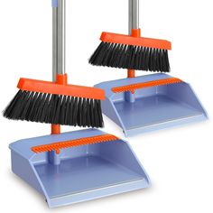 two brooms with brushes on them sitting next to each other