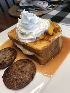 french toast with whipped cream and cookies on a plate