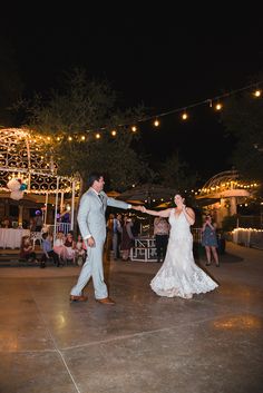 the bride and groom are dancing on the dance floor at their wedding reception in an outdoor venue