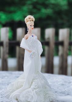 a barbie doll wearing a white wedding dress