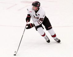 a female hockey player in action on the ice