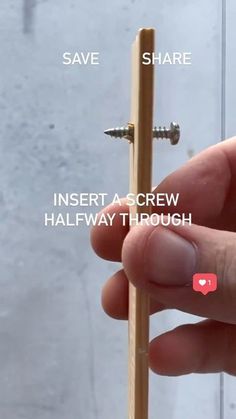 a person holding a wooden stick with two screws on it and the words inset a screw halfway through